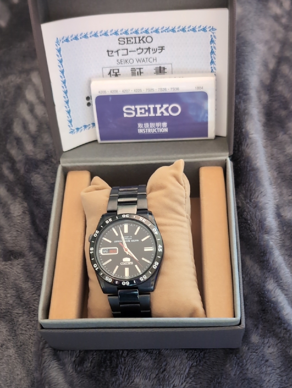 Seiko 5 (Automatic) Black and Silver Men's Watch with Blue Instruction Card